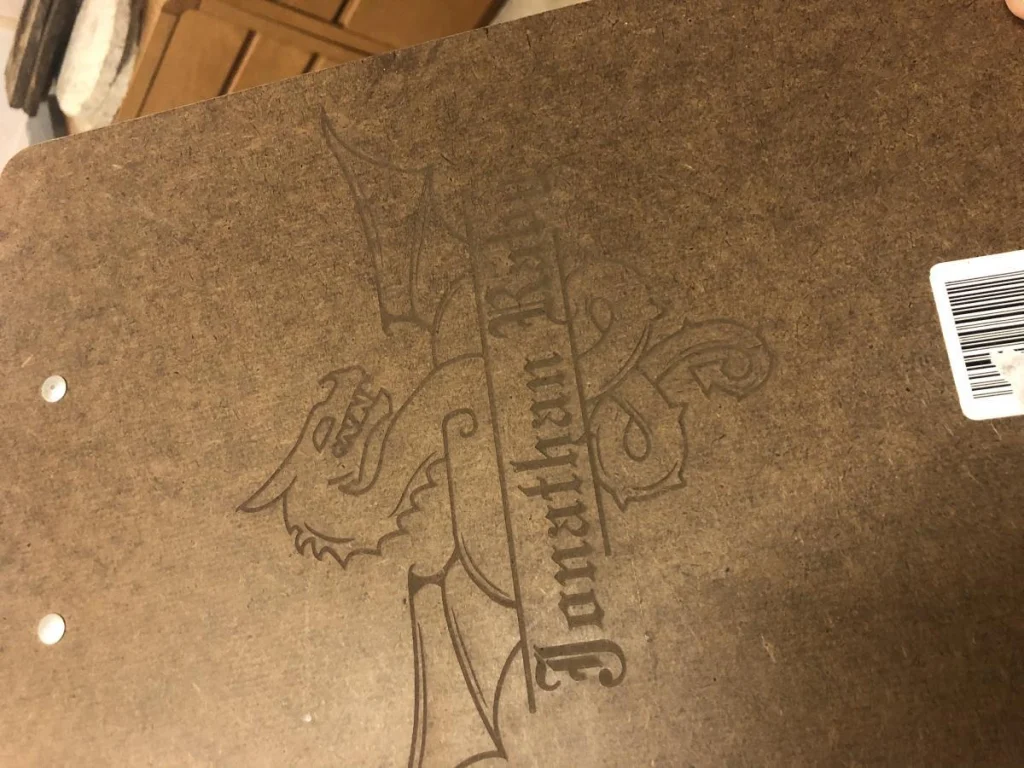 Wooden surface with dragon design and text